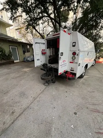Magnet Plumbing service vehicle on-site for Grease Trap Cleaning in Presidents